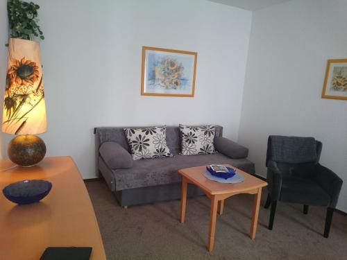 a living room with a couch and a table at Haus Alexander in Heringsdorf