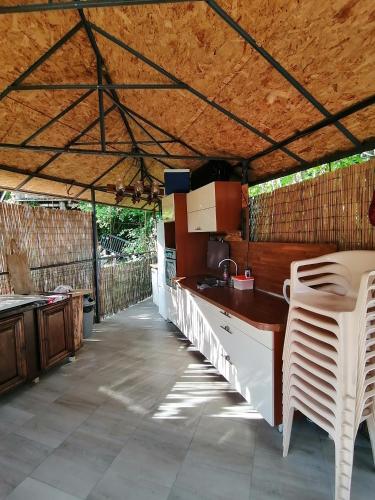 a kitchen with a counter and chairs in a tent at Edelweiss in Roussillon-en-Morvan
