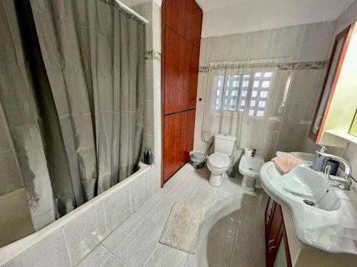 a bathroom with a sink and a toilet and a shower at Cozy apartment 3 in Serres