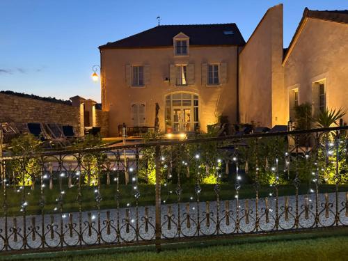 a house with lights in front of it at Hotel Particulier Les Rêveries du CLOS derrière St Jean Vignes &Spa Adult Only in Pommard