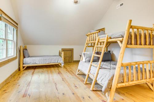 a room with two bunk beds and a couch at 1 Mi to Downtown Cashiers Private Cabin with Deck in Cashiers
