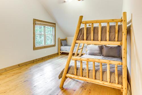 a bedroom with a bunk bed in a house at 1 Mi to Downtown Cashiers Private Cabin with Deck in Cashiers