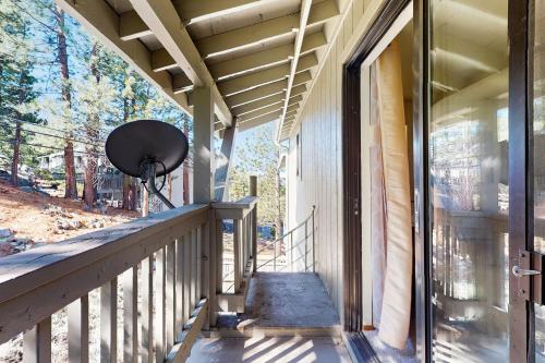 a porch of a house with a fan on it at South Star Pines Retreat in Stateline