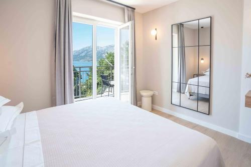 Posteľ alebo postele v izbe v ubytovaní Sea View Apartment Gin Brela