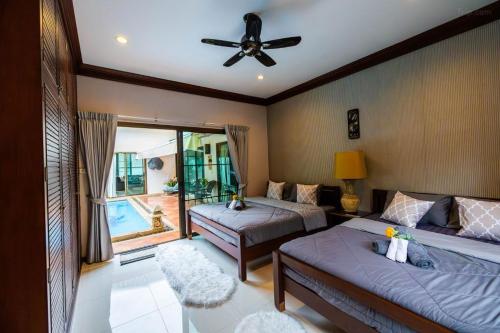 Ένα ή περισσότερα κρεβάτια σε δωμάτιο στο Villa in Pattaya City