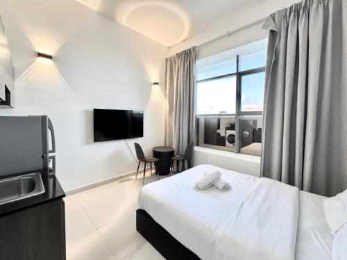 a hotel room with a bed and a window at Al Manara Classic Deluxe Sheikh Zayed Studio in Dubai