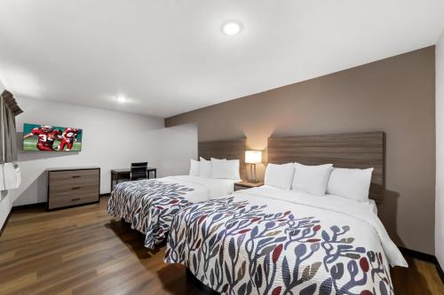 a hotel room with two beds in a room at Red Roof Inn Del Rio in Del Rio