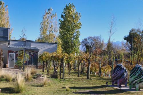 a house with a garden with trees in front of it at Alojamiento Traslaviña in Vista Flores