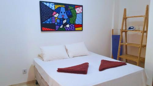 Ένα ή περισσότερα κρεβάτια σε δωμάτιο στο RES FLATS ANGELIM III - 2 QUARTOS Com AR no Centro