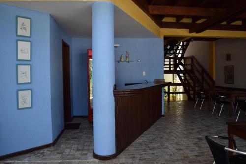 a room with a blue wall and a blue floor at Hotel Pousada Encanto de Itapoan in Salvador