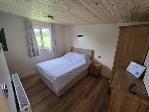 Postel nebo postele na pokoji v ubytování Dunroaming Cabin