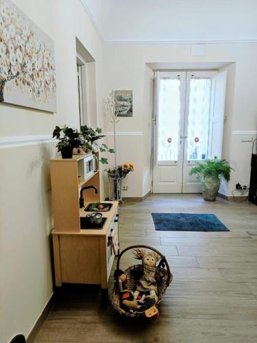 a living room with a counter and a kitchen at Casa Parrinello Maletto Etna in Maletto