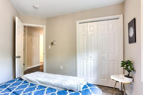a bedroom with a bed and a white door at Creek Front Pocono Mountain Getaway with Game room & Sauna in Tobyhanna