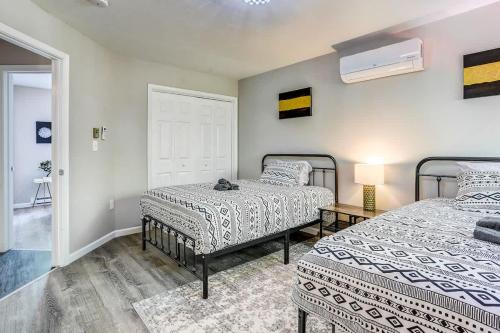 a bedroom with two beds and a window at Creek Front Pocono Mountain Getaway with Game room & Sauna in Tobyhanna