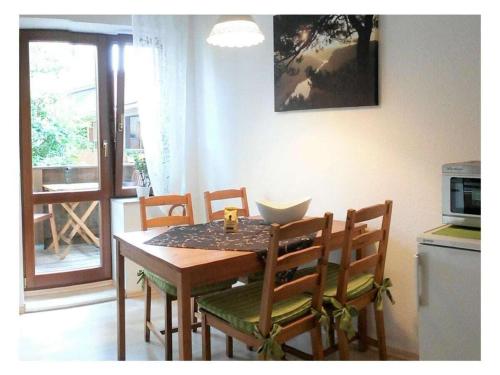 a dining room table and chairs in a kitchen at above painters studio in Pirna