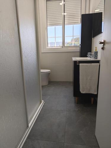 a bathroom with a sink and a toilet in a room at Casa Buro in Bueu