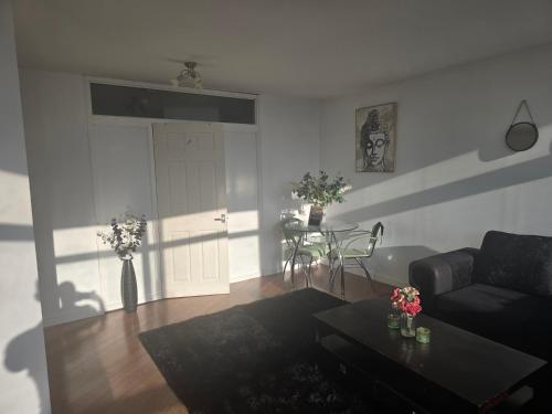 a living room with a couch and a table at Ventro Apartments LIVERPOOL in Liverpool