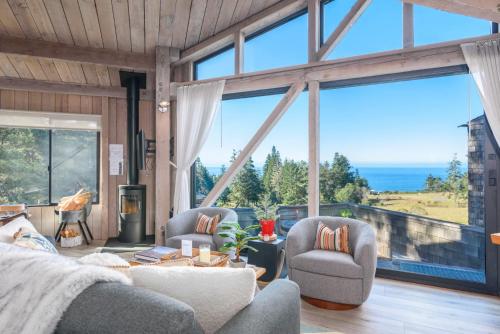 a living room with a view of the ocean at Architectural Treasure - Private Hot Tub in Sea Ranch
