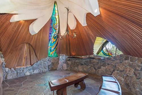 a living room with a bench and a tent at Architectural Treasure - Private Hot Tub in Sea Ranch