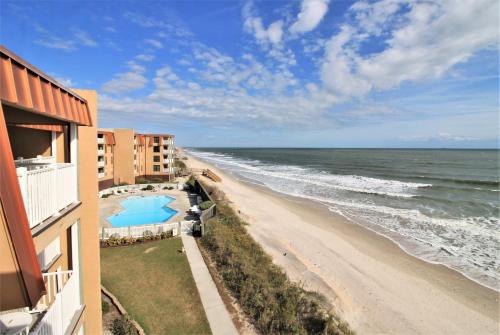 a view of the beach from the balcony of a condo at Topsail Dunes 2308 in Chadwick Acres