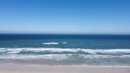a view of the ocean from a beach at Blue Mist Motel - Room #4 in Daytona Beach