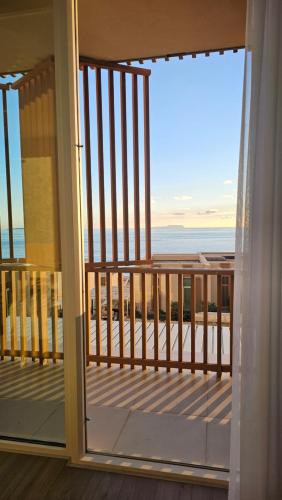 a balcony with a view of the ocean at Whisky Green Coast Hotel & Apartments in Palasë