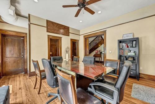 a dining room with a table and chairs at The Broadway #5 at the Historic Connely Harrington in Siloam Springs