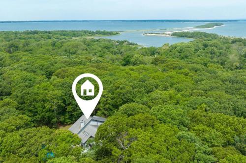 an aerial view of a house in the middle of a forest at Entertainment Galore, Meadowood Manor by RoveTravel in Sag Harbor