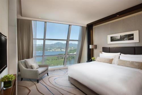 Postel nebo postele na pokoji v ubytování Sunrise Kempinski Hotel Beijing