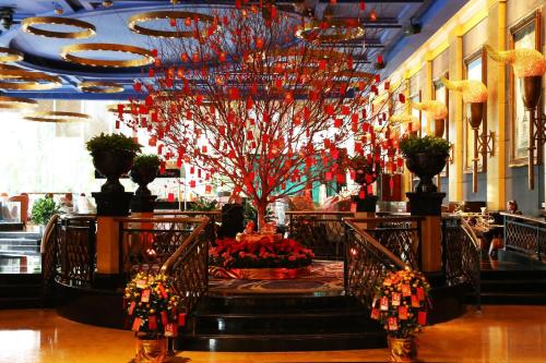 a lobby with a christmas tree in a building at Kempinski Hotel Shenzhen - 24 Hours Stay Privilege, Subject to Hotel Inventory in Shenzhen