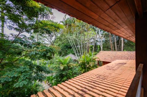 a view from the roof of a house with trees at Putini Pousada e Hotel by OYO in São Roque