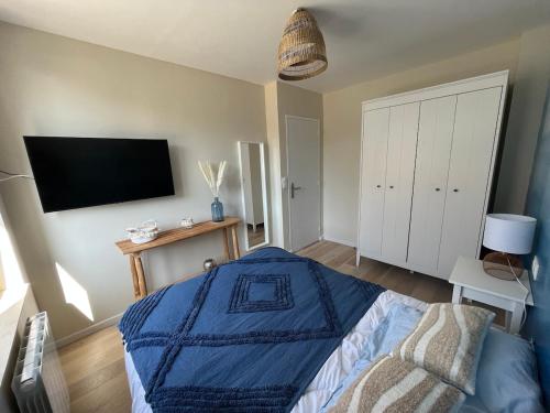 Ένα ή περισσότερα κρεβάτια σε δωμάτιο στο Le Bellevue Appartement