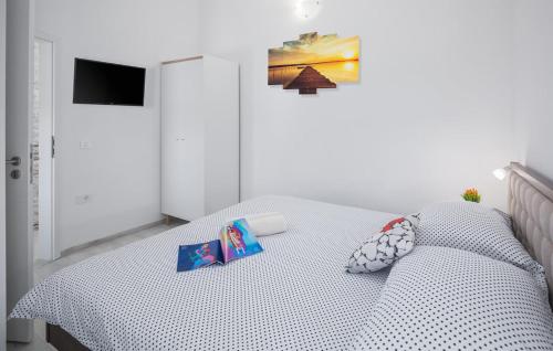 a bedroom with a bed with a white bedspread at Cassa Antica with outdoor pool, near Poreč in Rapavel