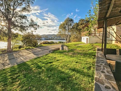 a view of the water from the backyard of a house at Casas Rurales Los Molinos in Sanlúcar de Guadiana