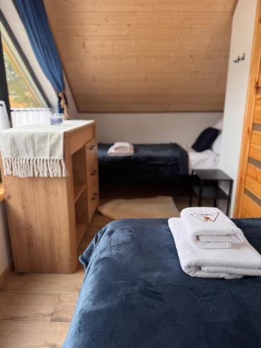 a room with a bed and a sink in a room at Forest Mood in Wieck