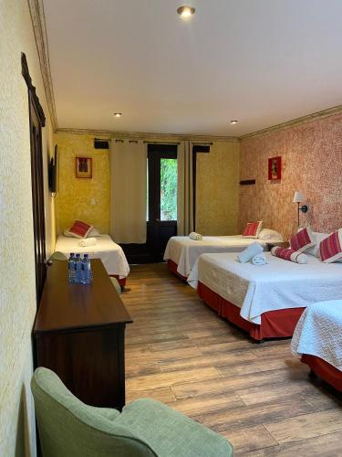 Ένα ή περισσότερα κρεβάτια σε δωμάτιο στο Casa Mia Hotel