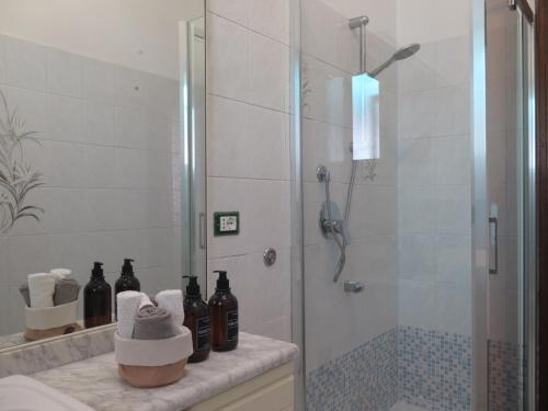 a bathroom with a shower with a glass door at House of Jane-2 Free PRIVATE Parkings - in Rapallo