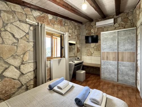 Кровать или кровати в номере Villa Vangelis Stylos Crete