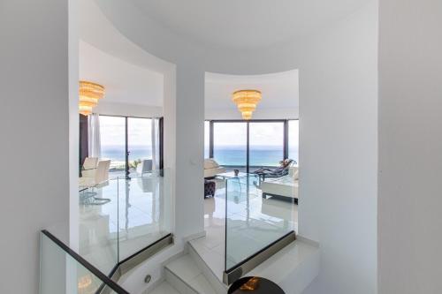 a room with a view of the ocean at Villa Dione Palace in Falasarna