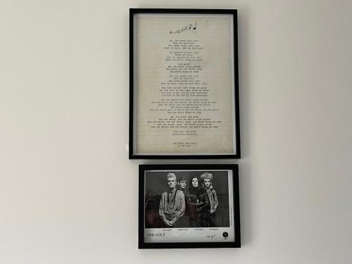 two framed photographs of two men are on a wall at Rothesay, Isle of Bute in Rothesay