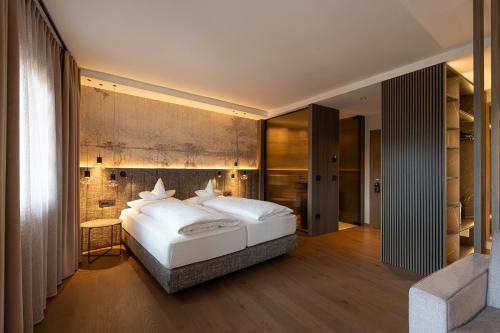 Ein Bett oder Betten in einem Zimmer der Unterkunft Hotel Zum Mohren