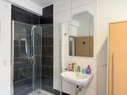 a bathroom with a shower and a sink at CoBa in Baden-Baden