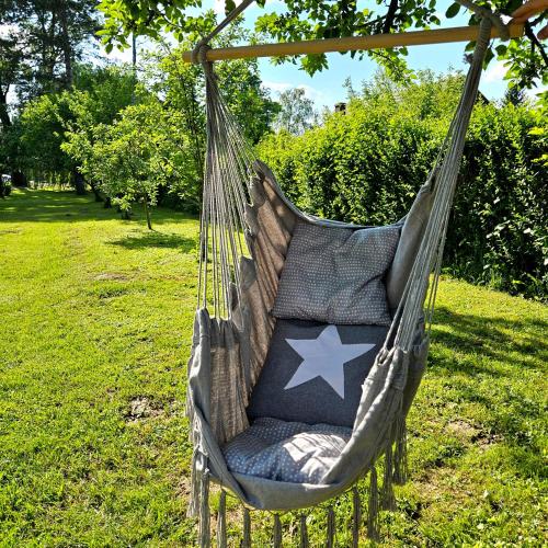 a hammock with an american flag on it at River Point, kuća za odmor in Žažina