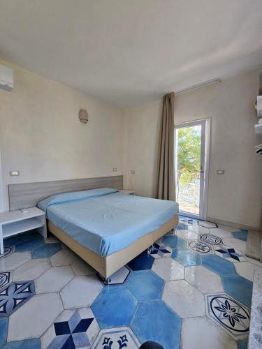 Postel nebo postele na pokoji v ubytování Appartamenti - Villa Mare
