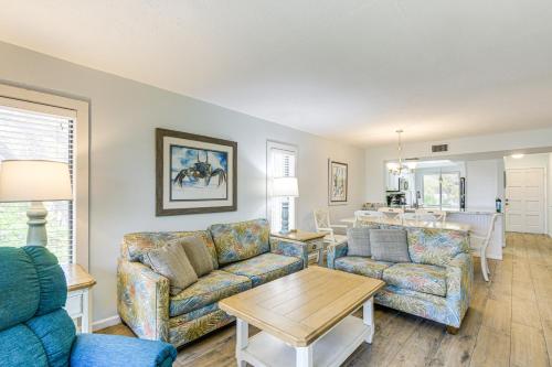 a living room with two couches and a table at 2 Mi to Sombrero Beach Condo with Pool and Hot Tub in Marathon