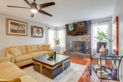 a living room with a couch and a fireplace at 4 Mi to Stone Mountain Retreat with Office! in Stone Mountain