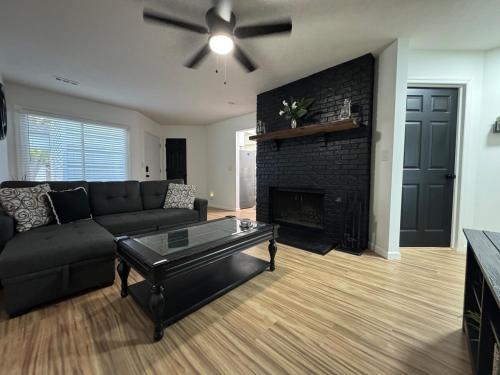 a living room with a couch and a fireplace at Contemporary Cutie in Lincoln