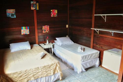 Pousada Casa de Praia房間的床