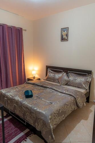 Katil atau katil-katil dalam bilik di Baith al jannah family friendly rooms