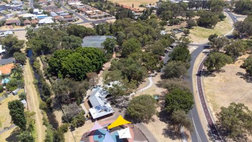 an aerial view of a village with a road and houses at South Bunbury Retreat in Bunbury